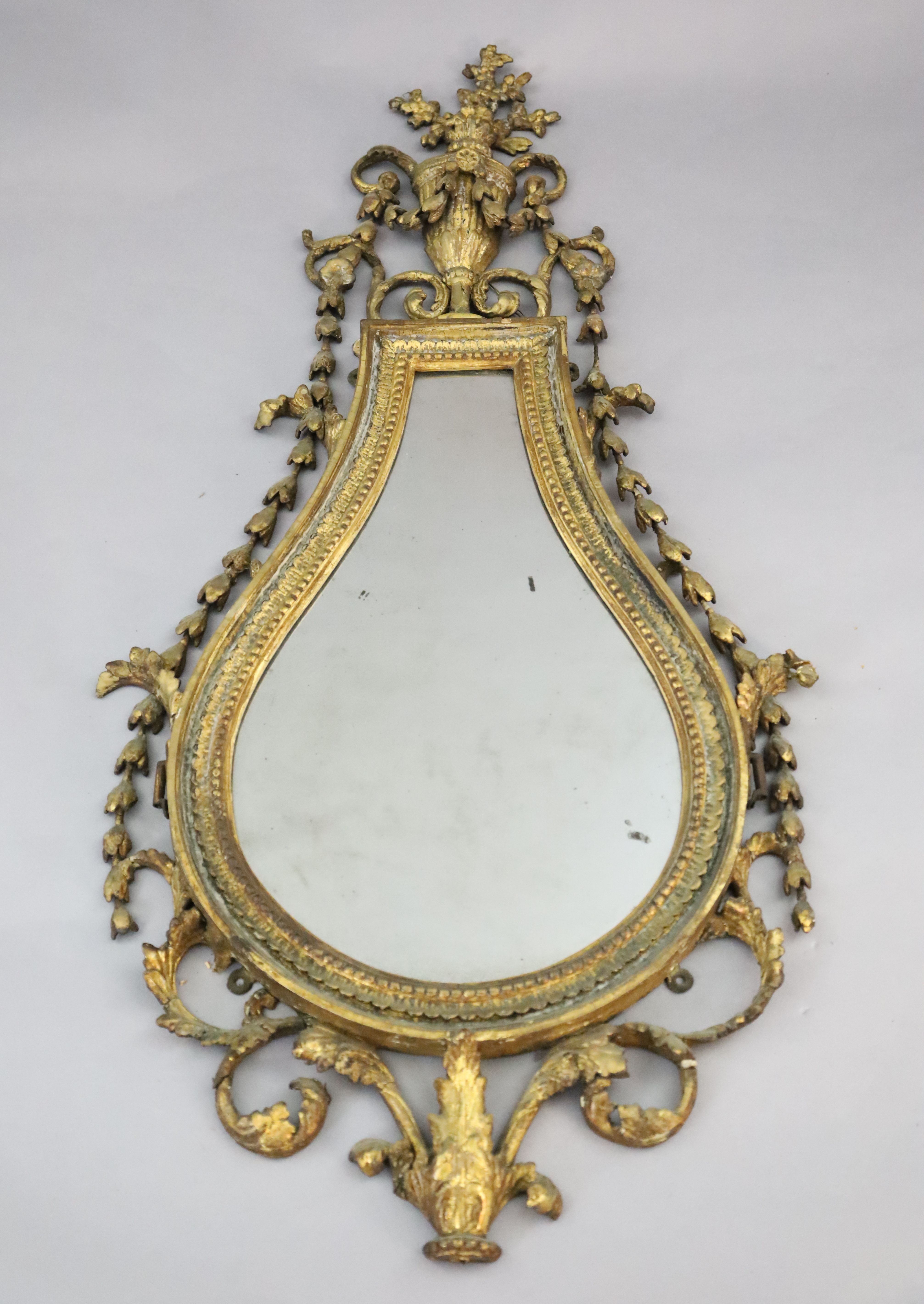 An early 19th century giltwood and gesso wall mirror, W.1ft 10in. H.3ft 9in.